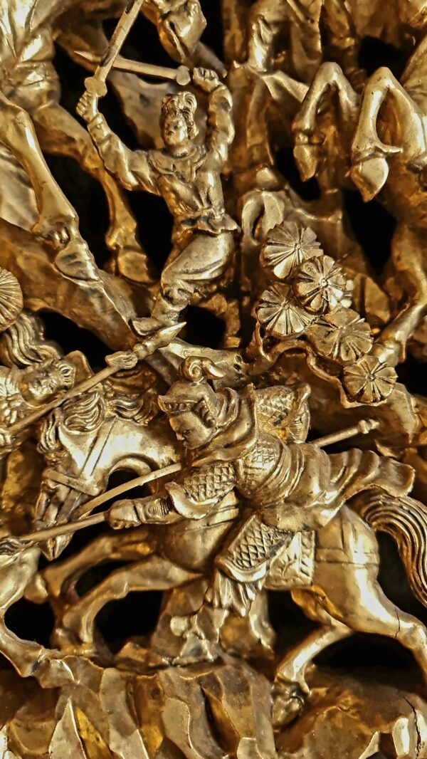 A Chinese Carved Deep Relief Gilt Wood Panel Depicting Warrior Scenes