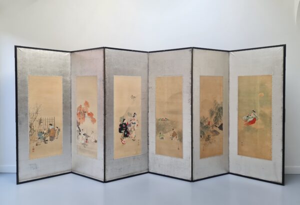 A large Japanese folding screen with six watercolor paintings