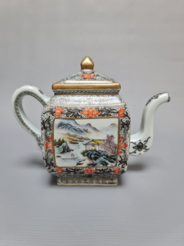 A rare Chinese porcelain hand-painted teapot with a landscape scene and a red overglaze mark